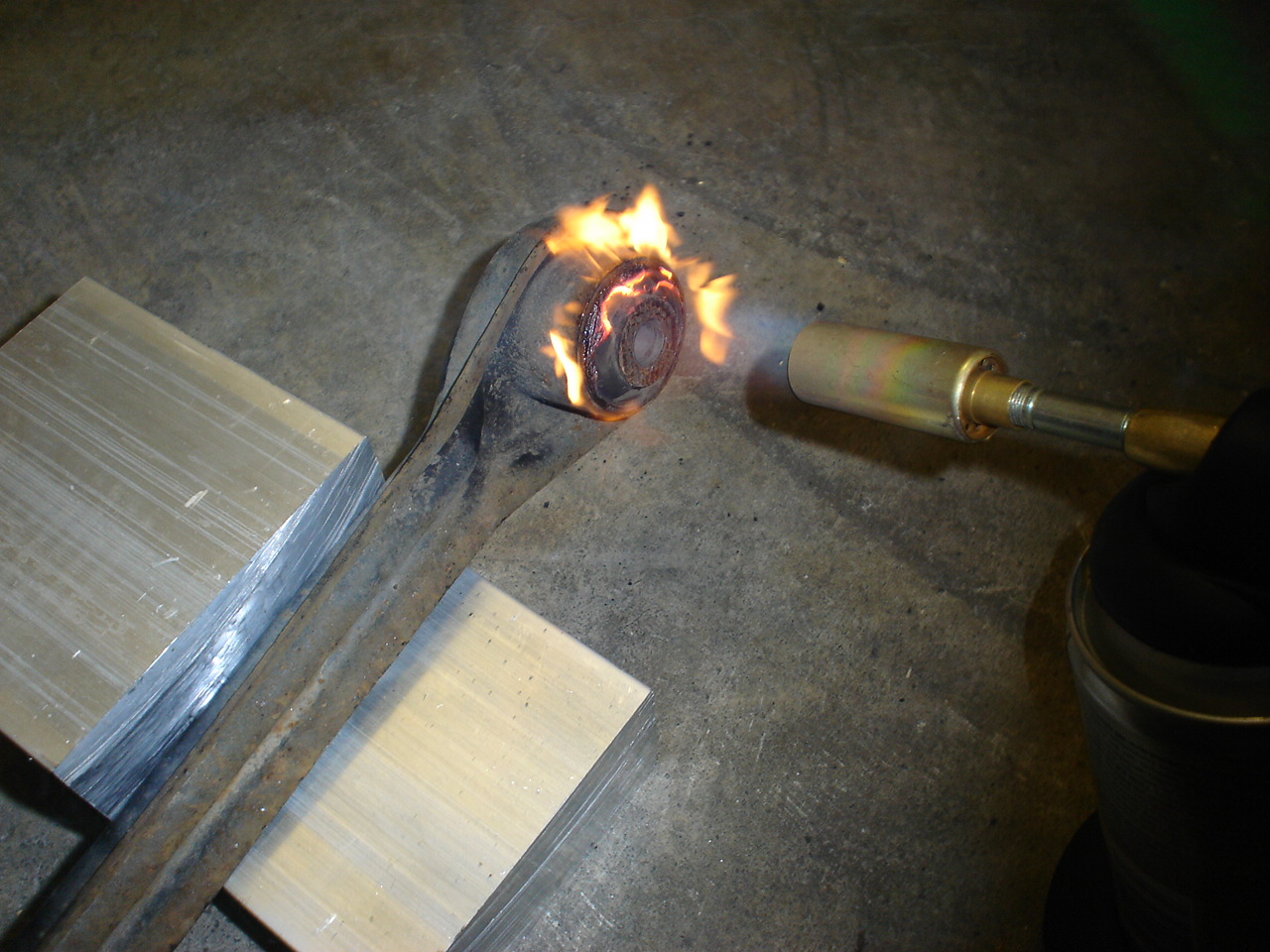 Burn the old rubber bushing out of the arm